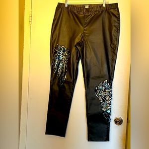 Black leatherette leggings with Angel Wings Jeweled details. Gently worn.